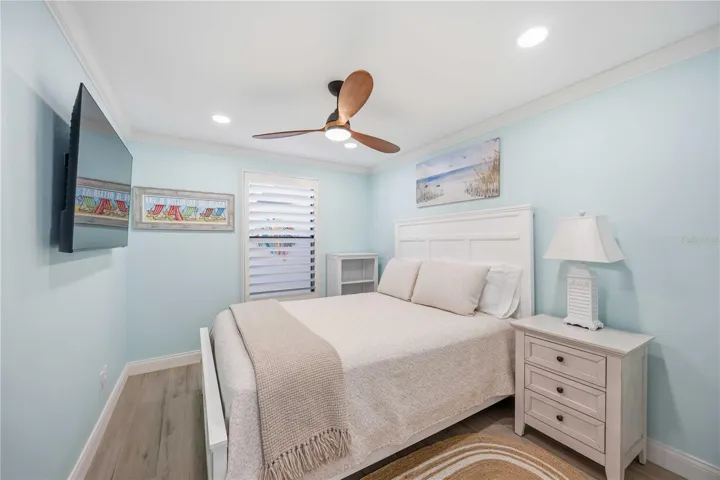 Coastal-inspired guest bedroom with soothing tones and a beautifully updated en-suite bath