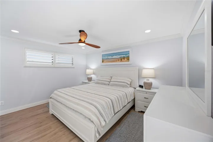 Spacious primary suite with calming coastal palette, updated finishes, and abundant natural light.