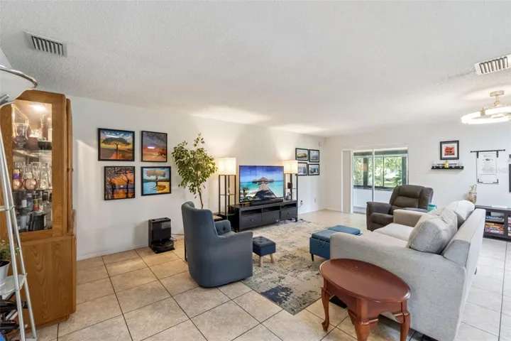Main living area is a great room with sliders overlooking your back porch and yard.