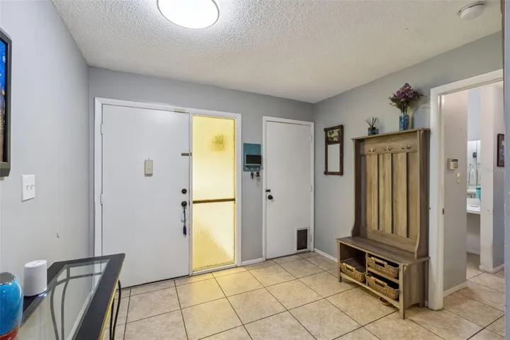 Step into the foyer with a door to the garage.