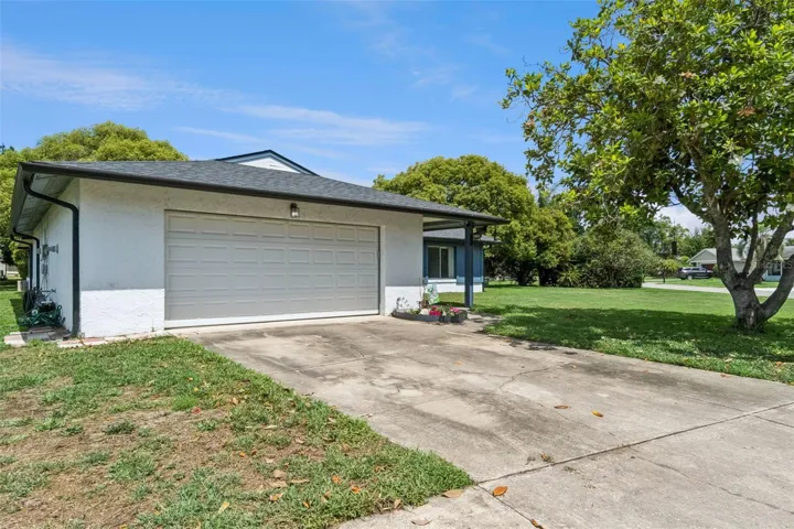 Large 2 car garage with built in storage and utility area for washer and gas dryer.