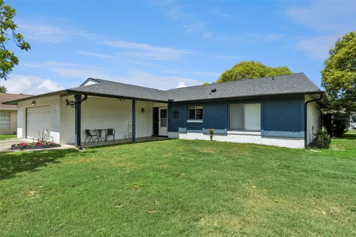 Large covered front porch walk-way highlights the front of the home.