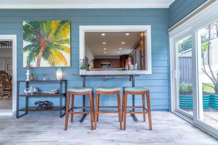 Pass-through from the kitchen to the sunroom and bar