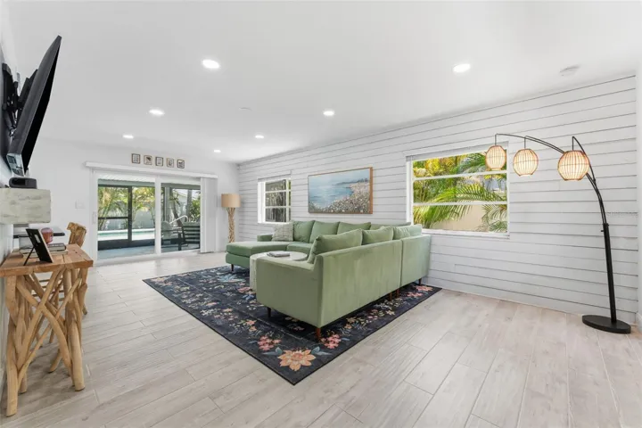 Clean coastal vibes and views of the sparkling pool once you step inside