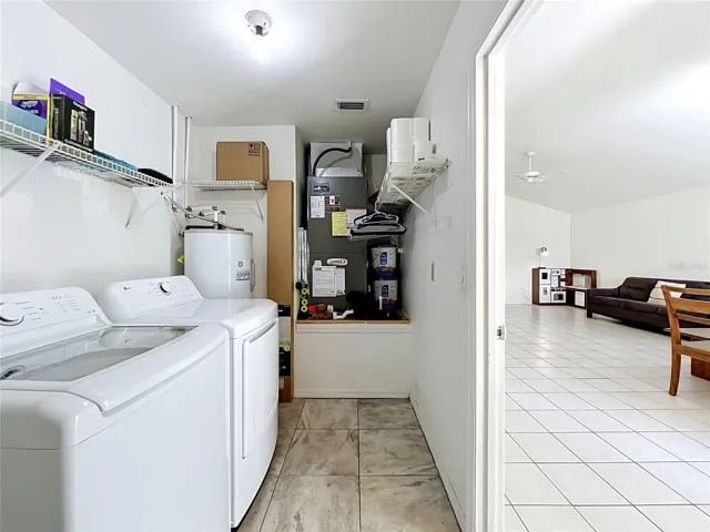 Enter this home through the garage, which leads directly into a convenient laundry and utility room.