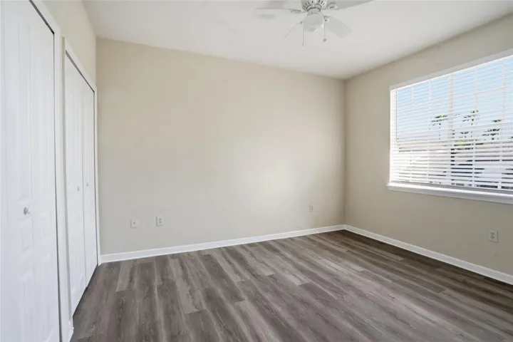 Bedroom 3 w/ new lux vinyl flooring, ceiling fan