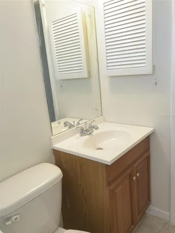 Bathroom off bedroom.