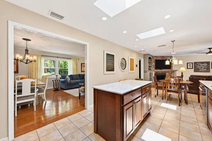 Formal living and dining spaces flow into the kitchen for effortless entertaining.