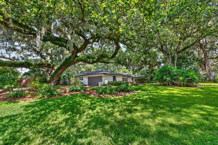 Mature trees create a park-like setting.