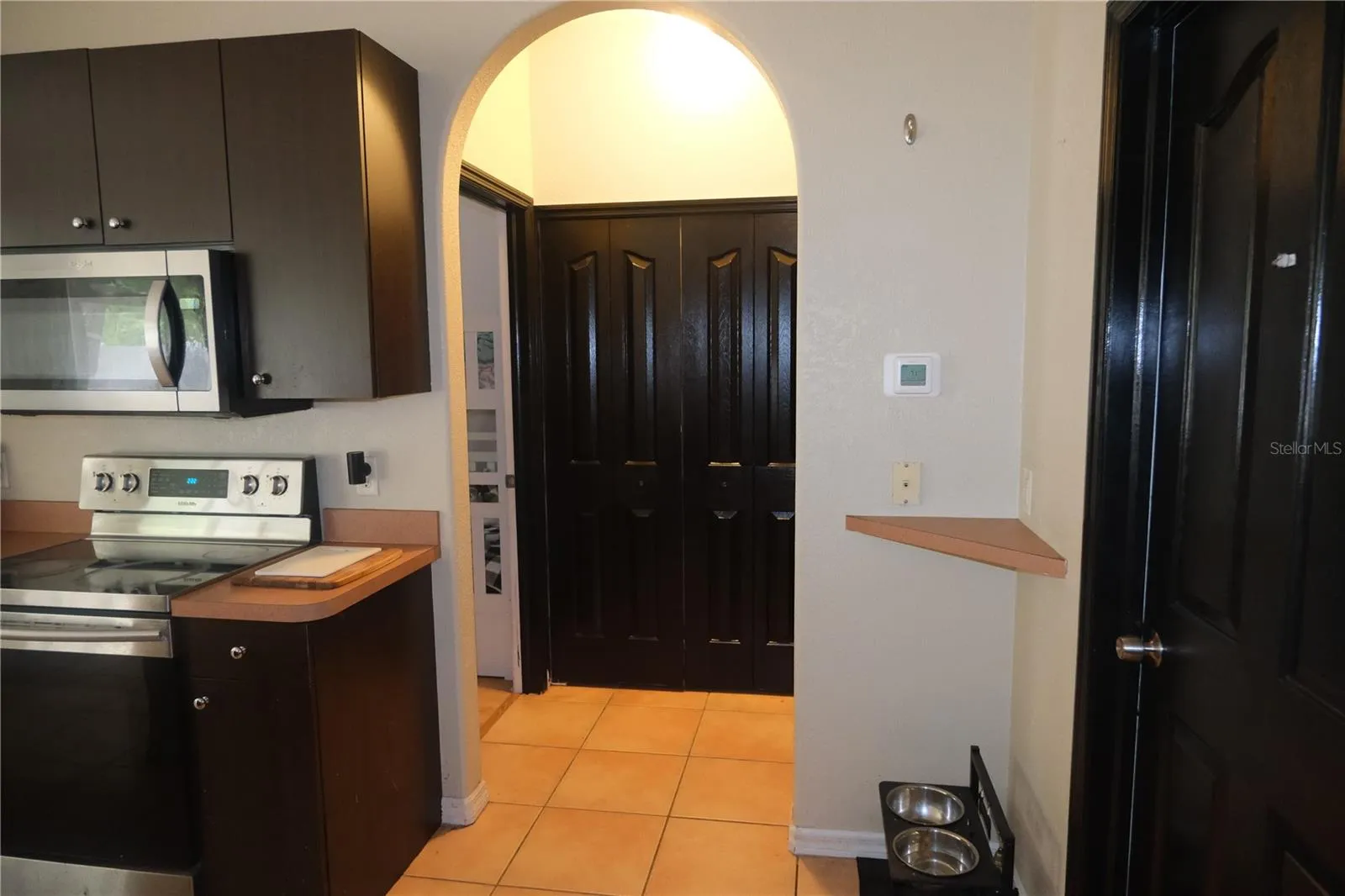 Arch doorway to 2 bedrooms
