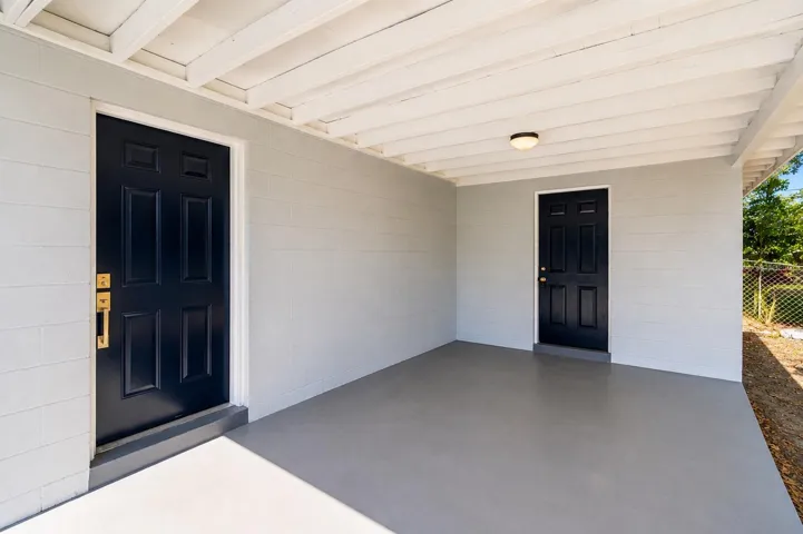 Carport with entry door and Laundry room door
