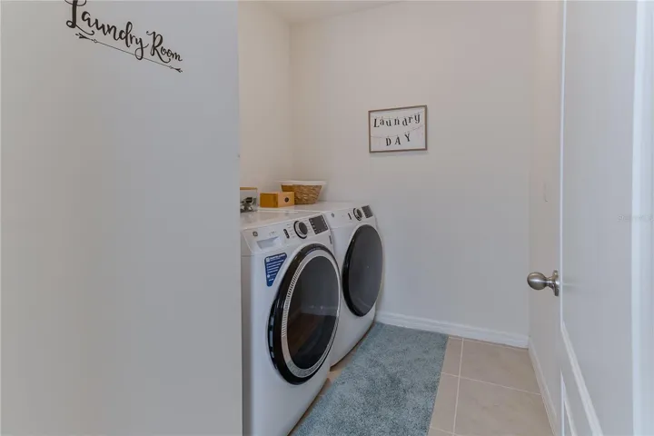 Dedicated laundry room with washer and dryer included.