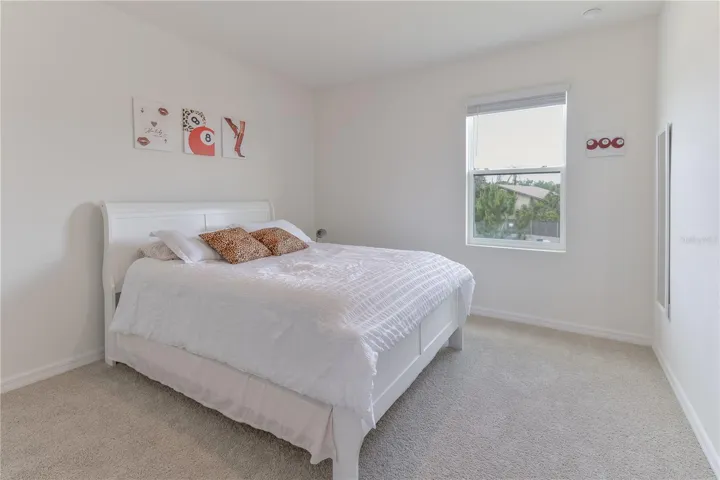 Additional spacious bedroom with neutral finishes.