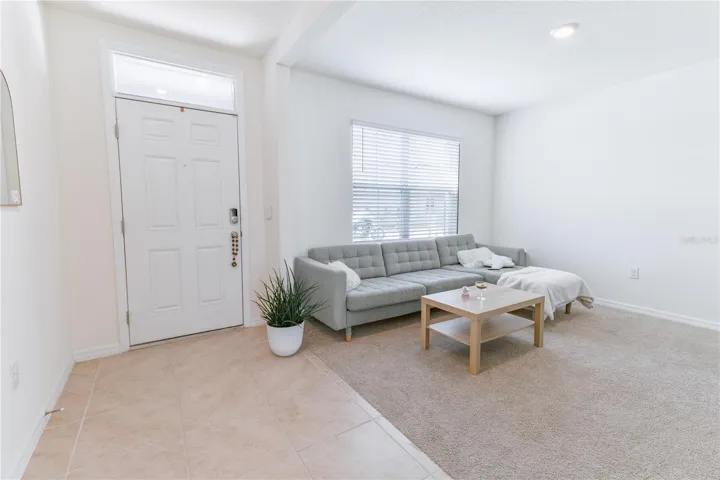 Flexible front room ideal for office, sitting area, or playroom.