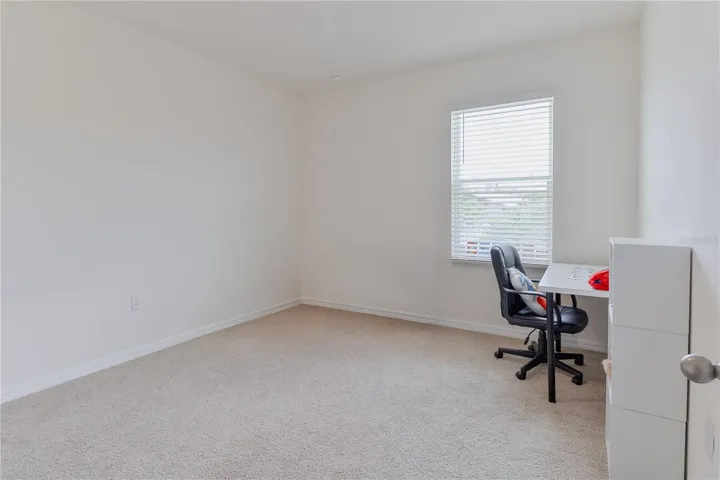 Additional spacious bedroom with neutral finishes.