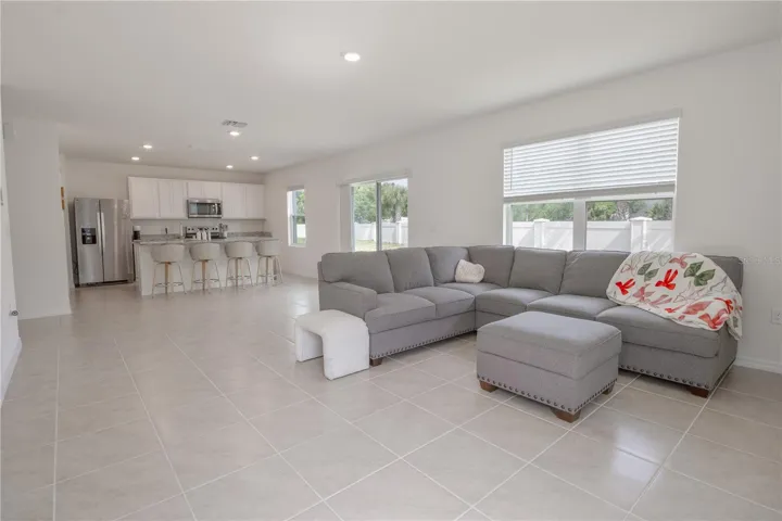 Open-concept living area with abundant natural light and oversized gathering space.