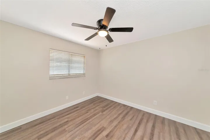 Bedroom 2 with vinyl flooring