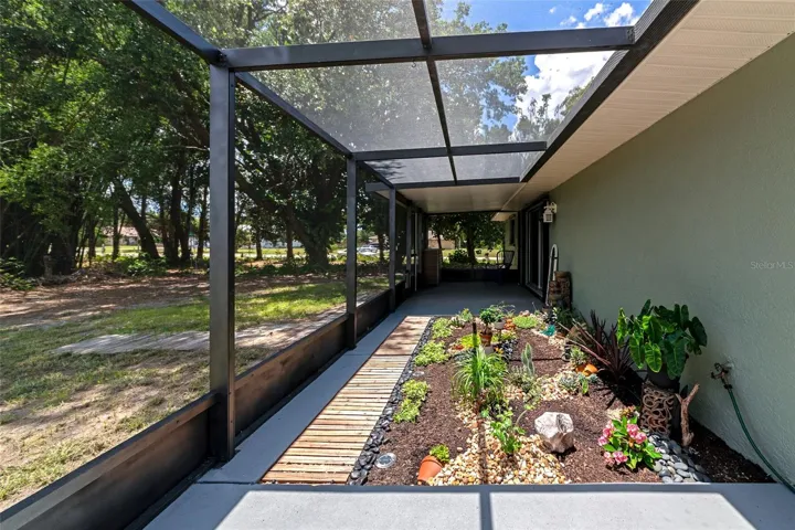 Serene garden setting on screened lanai