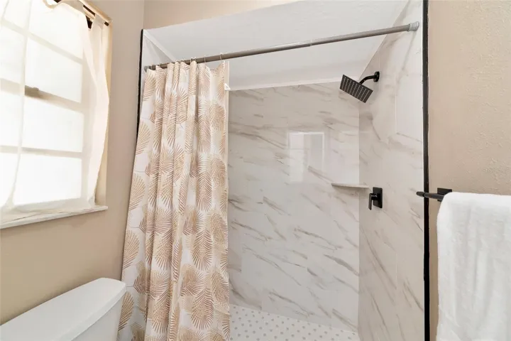 prime bathroom with all new shower