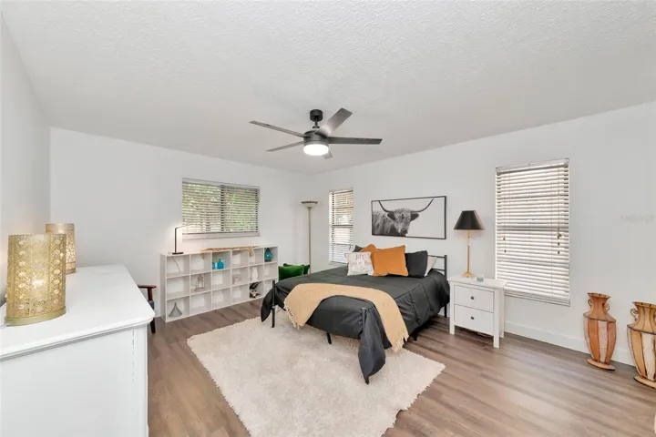 spacious Prime bedroom with luxury vinyl flooring