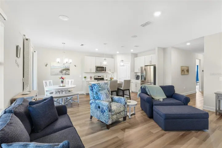 Open Floor-plan with Kitchen and Great Room overlooking the Lanai with breathtaking expansive water and preserve view from every angle.