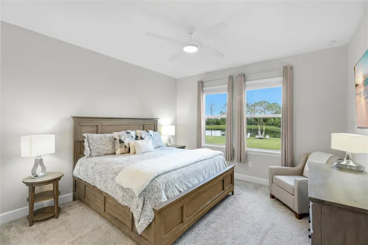 Owners Suite with expansive water and preserve views from every angle of the room.