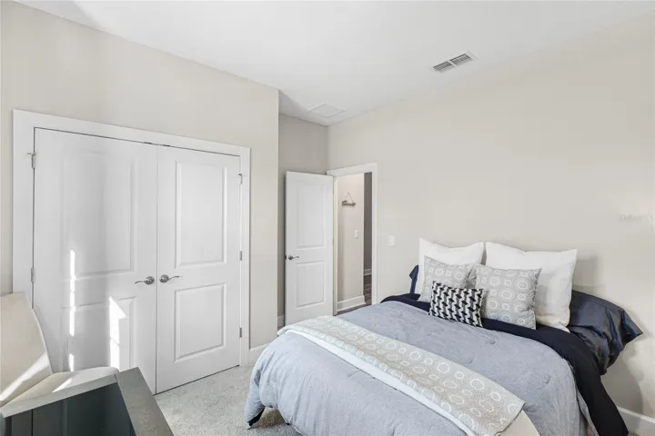 Guest Bedroom 2 with large built in closet and large window to bring in abundant natural light.