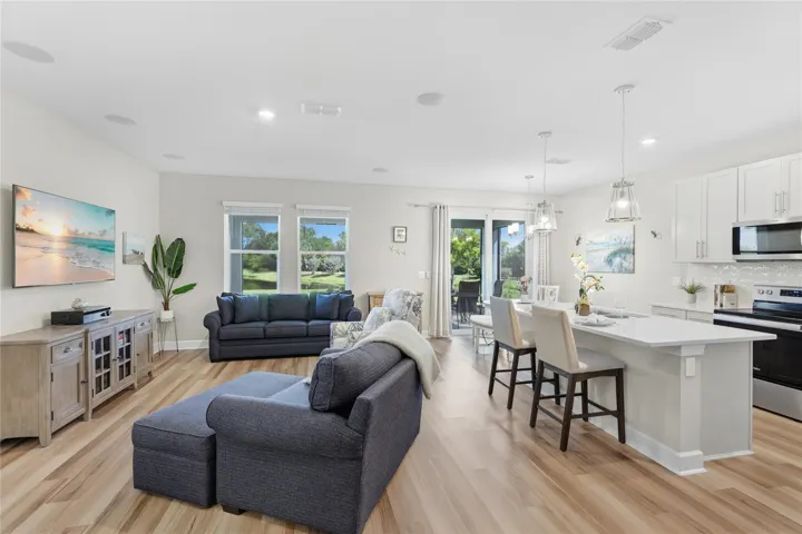Open Floor-plan with Kitchen and Great Room with ceiling sound system, overlooking the Lanai with breathtaking expansive water and preserve view from every angle.