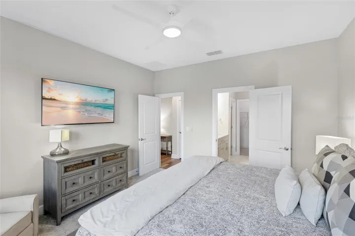 Owners Suite with expansive water and preserve views from every angle of the room.