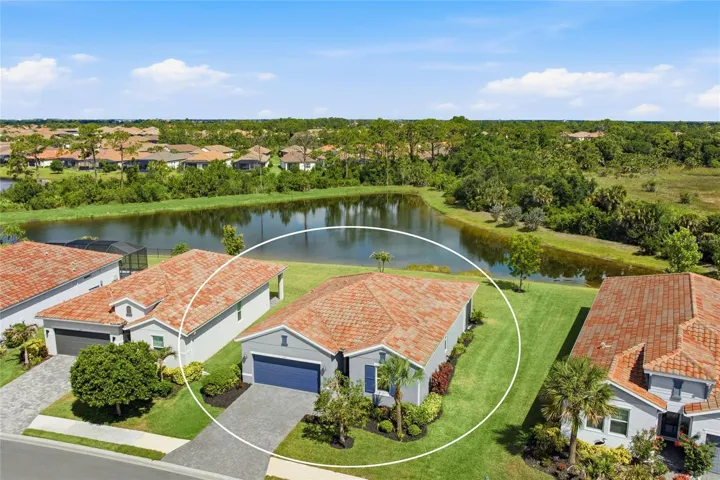 Beautiful premier water-view Lot with preserve behind it and with extra space between the homes.