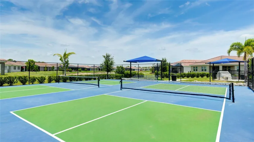 Four Pickleball Courts with covered spectator seating.