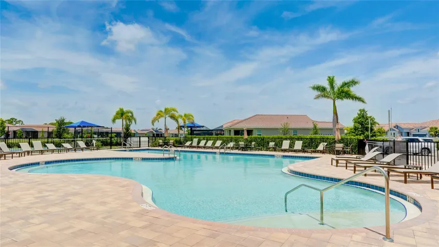 Resort Style Pool with Lap Lanes and lounge chairs on the pool deck