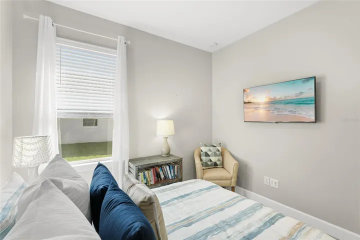 Guest Bedroom 3 with large built in closet, large window and recessed light.