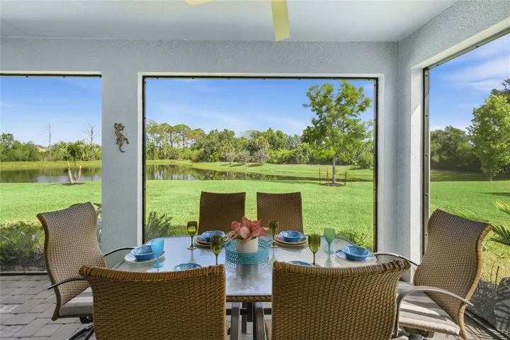 Screened in, covered and extended Lanai with access door, two ceiling fans and panoramic water and preserve views.