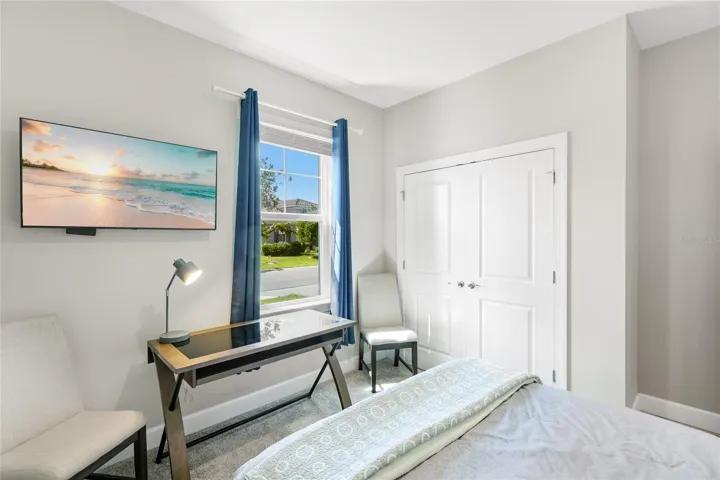 Guest Bedroom 2 with large built in closet and large window to bring in abundant natural light.