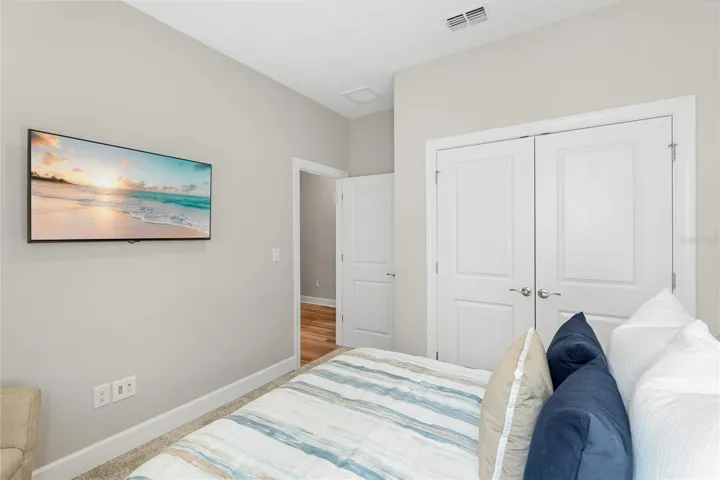 Guest Bedroom 3 with large built in closet and large window to bring in abundant natural light.