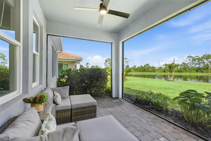 Screened in, covered and extended Lanai with access door, two ceiling fans and panoramic water and preserve views
