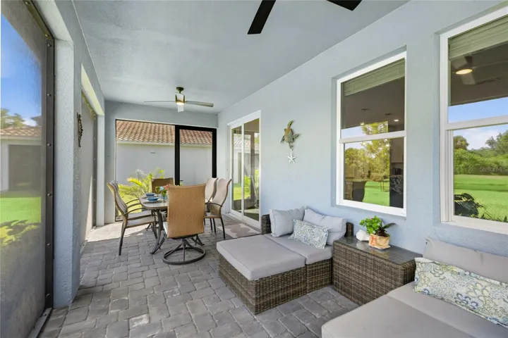 Screened in, covered and extended Lanai with access door, two ceiling fans and panoramic water and preserve views