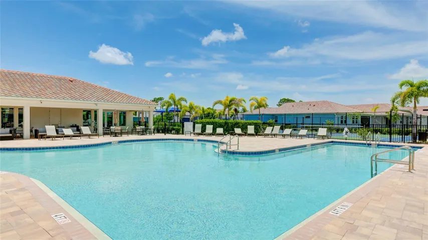 Resort Style Pool with Lap Lanes and and lounge chairs on the pool deck