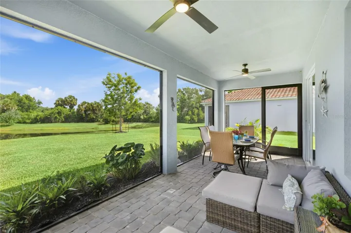 Screened in, covered and extended Lanai with access door, two ceiling fans and panoramic water and preserve views