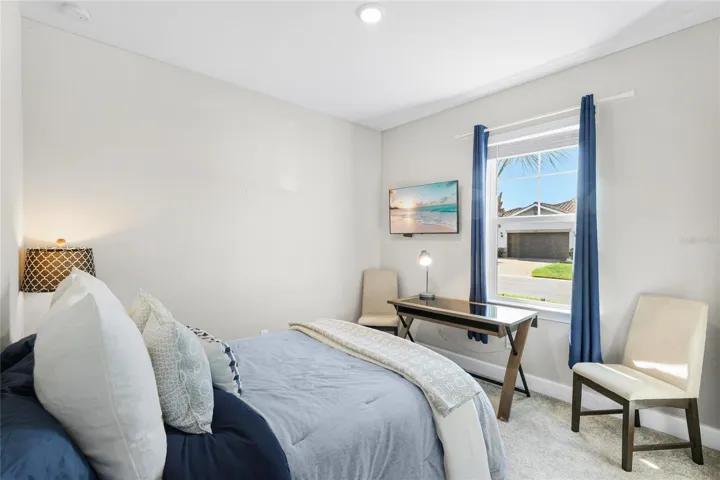 Guest Bedroom 2 with large built in closet and large window to bring in abundant natural light.