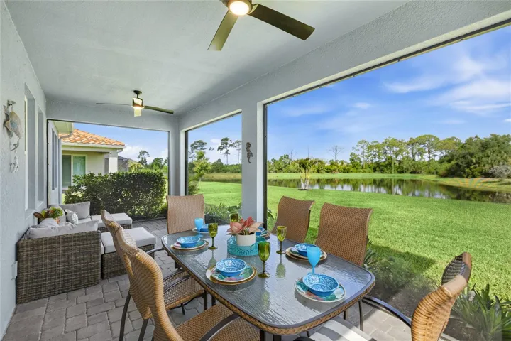 Screened in, covered and extended Lanai with access door, two ceiling fans and panoramic water and preserve views