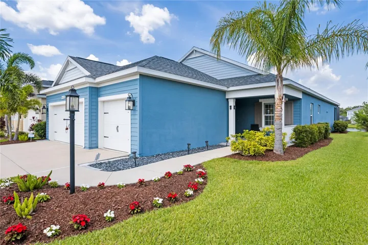 Covered front porch entry creates a welcoming space to relax and enjoy Florida evenings.