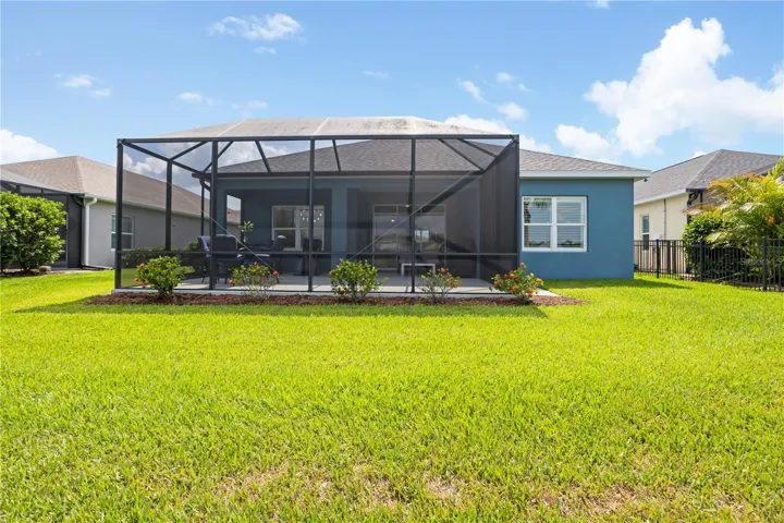 Screened Rear Lanai & BackyardThe extended screened lanai creates the perfect indoor-outdoor living experience with peaceful backyard views and plenty of room for entertaining, dining, or simply enjoying the Florida sunshine.