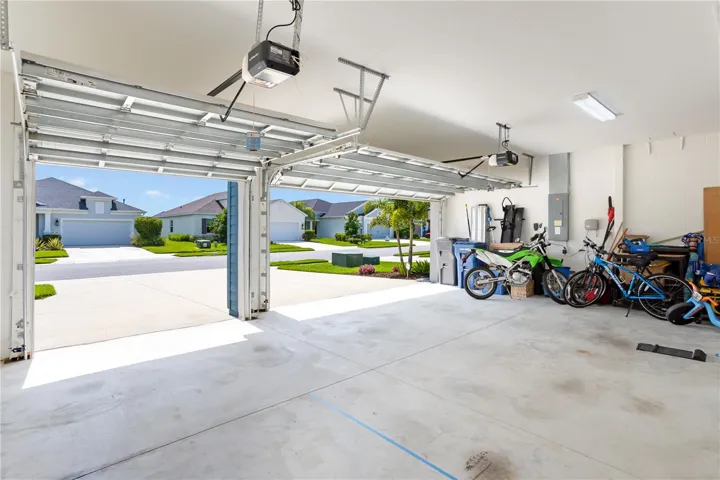 Extended-depth 3-car garage provides room for vehicles, storage, bikes, golf cart, or workshop space.