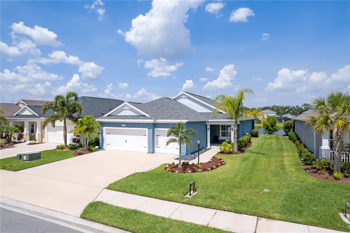 Impressive Exterior with Three-Car GarageThe home’s attractive exterior design combines modern Florida architecture with lush landscaping and a spacious three-car garage, providing ample parking, storage, and functionality for vehicles, golf carts, or recreational equipment.