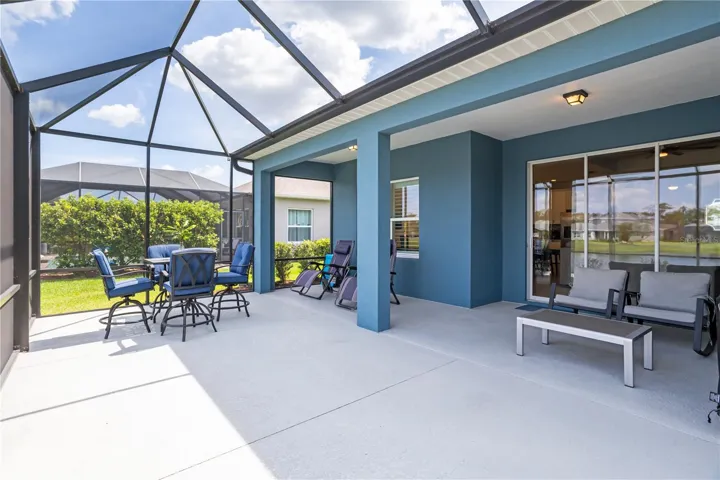 Outdoor dining area overlooking the pond creates the perfect setting for morning coffee or sunset dinners.
