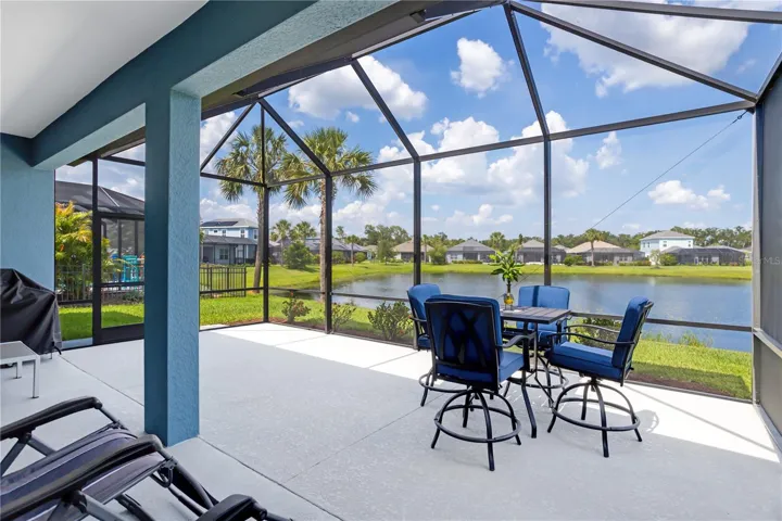 Screened outdoor living area blends indoor comfort with Florida outdoor lifestyle.