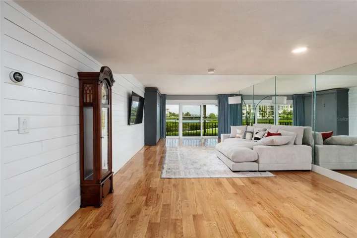 Dining area and living room with wall mounted 70