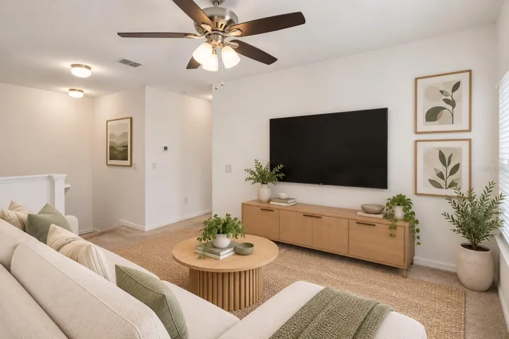 Versatile upstairs loft provides additional living space ideal for a media room, home office or casual lounge.